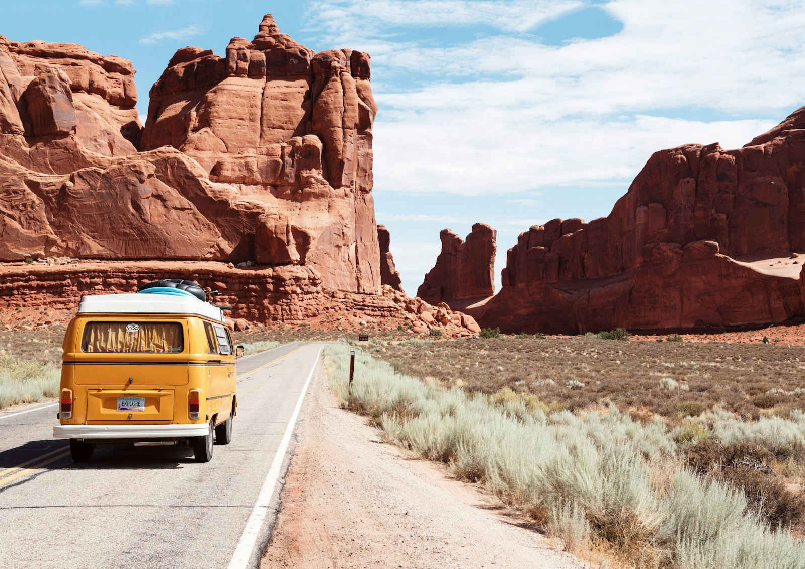 RV road trip on an open American highway at golden hour